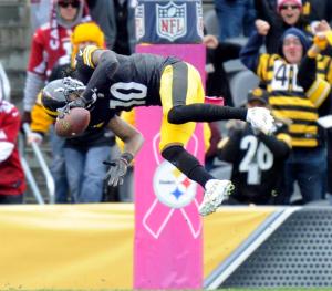 Pittsburgh Steelers wide receiver Martavis Bryant (10) flips into the end zone to score a touchdown after making a catch in the fourth quarter an NFL football game against the Arizona Cardinals, Sunday, Oct. 18, 2015 in Pittsburgh. The Steelers won 25-13. (AP Photo/Don Wright)