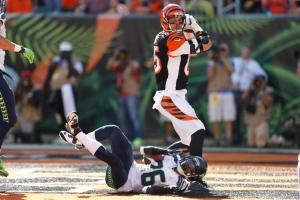 Cincinnati Bengals tight end Tyler Eifert (85) scores a touchdown against Seattle Seahawks cornerback Cary Williams (26) in the second half of an NFL football game, Sunday, Oct. 11, 2015, in Cincinnati. (AP Photo/Gary Landers)