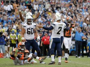 SAN DIEGO, CA - OCTOBER 04: Josh Lambo #2 of the San Diego Chargers celebrates with his teammates after hitting the game winning field goal, as Johnson Bademosi #24 of the Cleveland Browns looks on from the ground at Qualcomm Stadium on October 4, 2015 in San Diego, California. The Chargers defeated the Browns 30-27. (Photo by Jeff Gross/Getty Images)