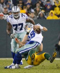 Green Bay Packers' Clay Matthews tackles Dallas Cowboys' Matt Cassel (16) during the first half of an NFL football game Sunday, Dec. 13, 2015, in Green Bay, Wis. (AP Photo/Mike Roemer)