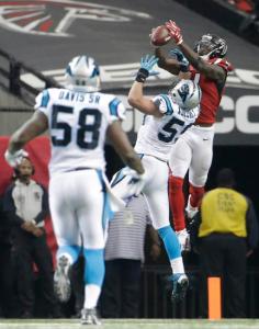 Atlanta Falcons wide receiver Julio Jones (11) catches the ball against Carolina Panthers middle linebacker Luke Kuechly (59) during the second half of an NFL football game, Sunday, Dec. 27, 2015, in Atlanta. (AP Photo/David Goldman)