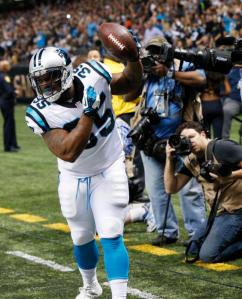 Carolina Panthers fullback Mike Tolbert (35) celebrates his touchdown in the first half of an NFL football game against the New Orleans Saints in New Orleans, Sunday, Dec. 6, 2015. (AP Photo/Bill Feig)