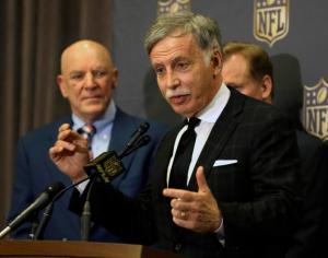 St. Louis Rams owner Stan Kroenke talks to the media after team owners voted Tuesday, Jan. 12, 2016, in Houston, to allow the Rams to move to a new stadium just outside Los Angeles, and the San Diego Chargers will have an option to share the facility. Houston Texans owner Bob McNair stands to his left. (AP Photo/Pat Sullivan)