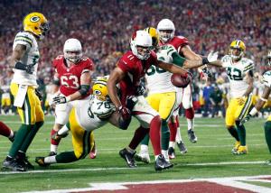 Arizona Cardinals wide receiver Larry Fitzgerald (11) scores the game-winning touchdown against the Green Bay Packers during overtime of an NFL divisional playoff football game, Saturday, Jan. 16, 2016, in Glendale, Ariz. The Cardinals won 26-20 in overtime. (Rob Schumacher/The Arizona Republic via AP) MARICOPA COUNTY OUT; MAGS OUT; NO SALES; MANDATORY CREDIT